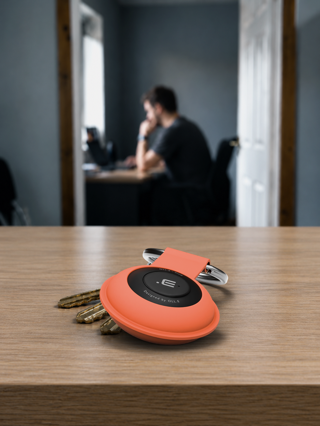 Heard from the next room — an Orange PinG on keys on a wooden table, a man working at a desk in the next room behind